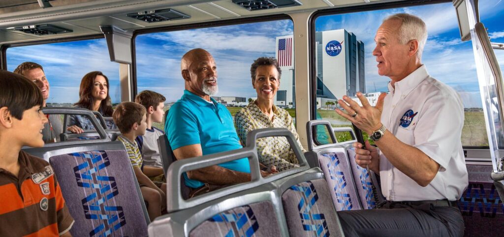 family on bus infront of Kennedy Space Center
