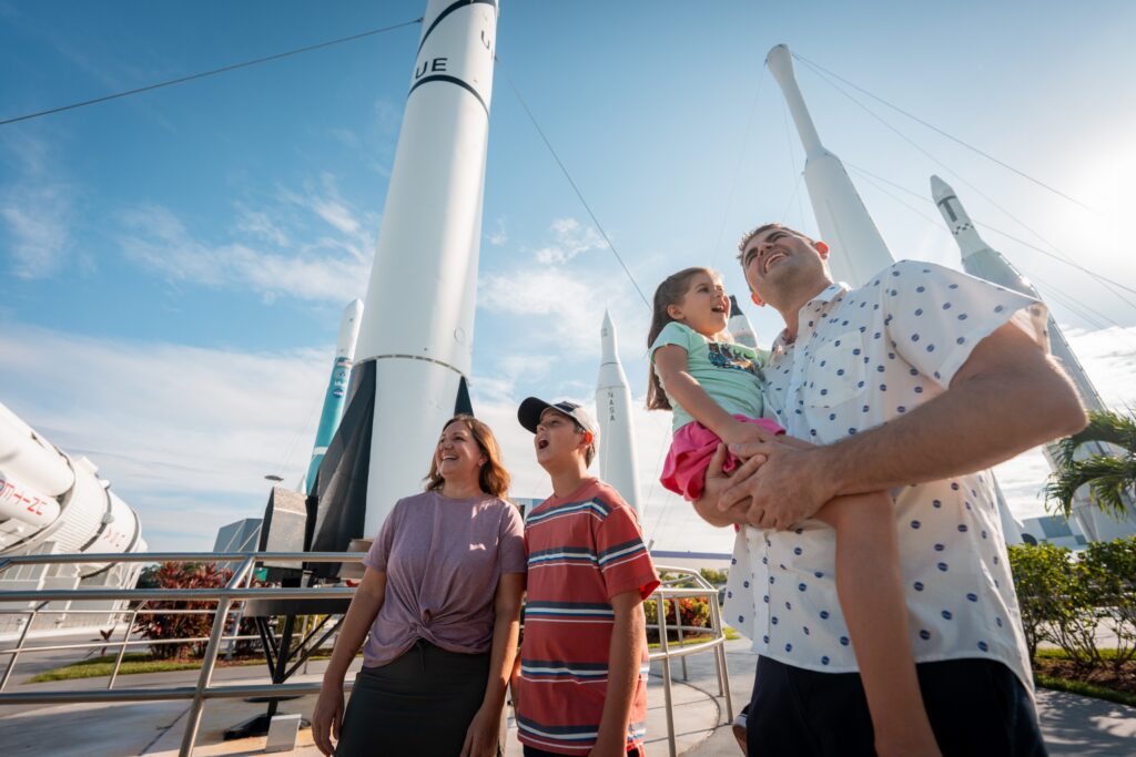 Family in the rocket garden at Kennedy Space Center taking in the sights on a sunny day